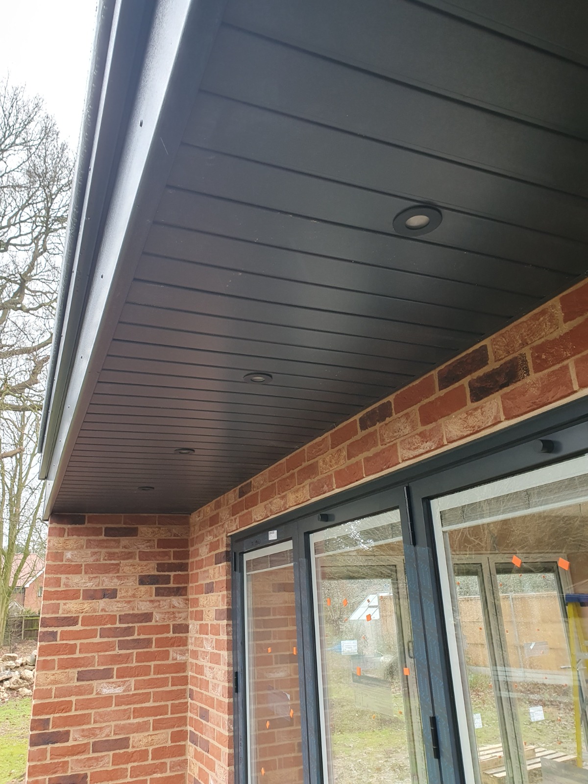 Recessed lighting and soffit on new-build bifold