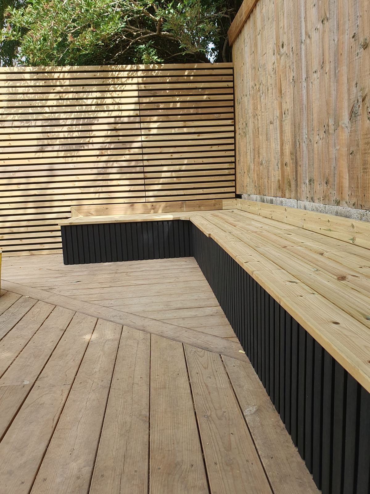 Finished garden decking with bench